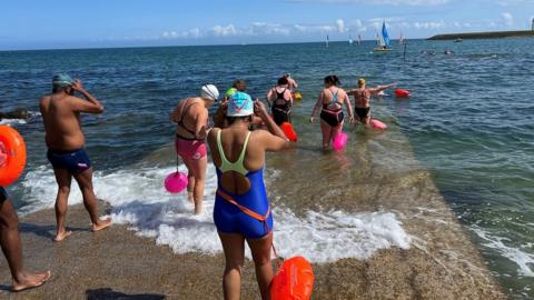 People getting into the sea in north Down