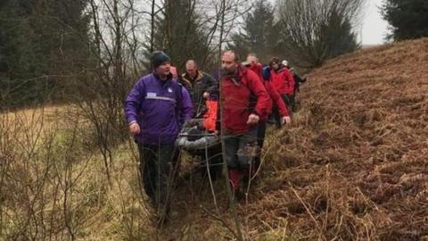 Rescuers with stretcher