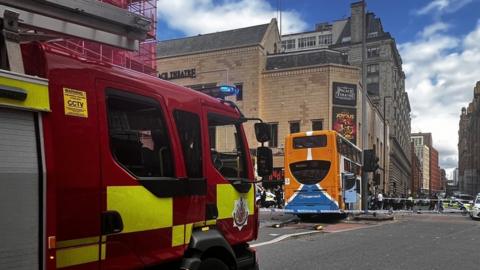 Fire engine at scene of bus crash on Oxford Street, Manchester