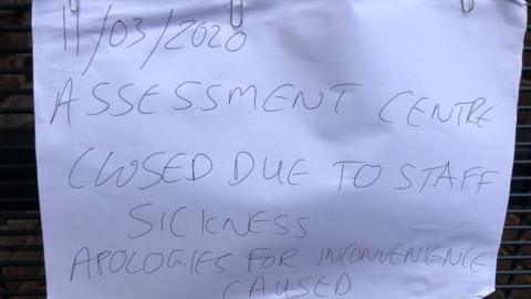 A sign placed on the door of the job centre