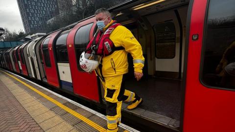 Nick Walton getting of a tube train