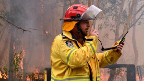 Firefighter carrying out back burning