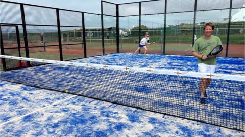 People playing padel on the court