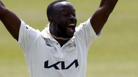 Kemar Roach celebrates a wicket for Surrey