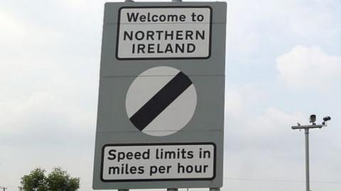 Traffic passes a border sign at Newry as you enter Northern Ireland from the south