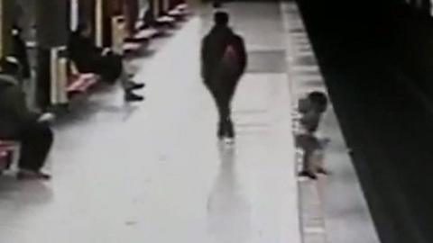 An 18-year-old stranger helped to lift the child up after he fell down on the rails at a station in Milan.