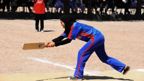 A woman playing cricket in Afghanistan in 2013