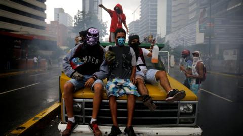 Demonstrators ride on a truck while rallying against Venezuelan President Nicolas Maduro's government in Caracas, June 29, 2017