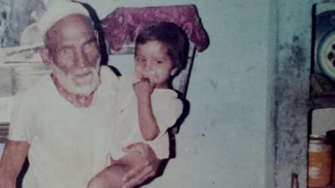 Mohammad Ali with one of his grandchildren