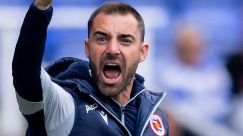 Reading boss Ruben Selles shouts to his team from the dugout during a League One match.