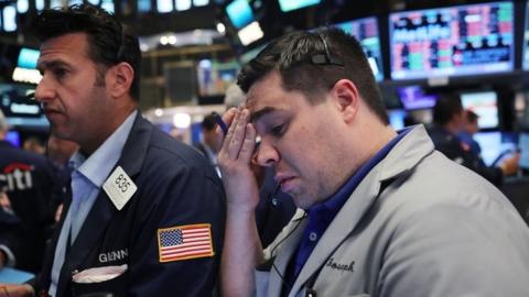 Traders work on the New York Stock Exchange following news that the UK has voted to leave the EU, 24 June 2016