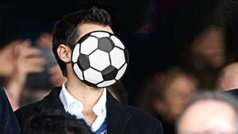 A celebrity with a ball hiding their face 