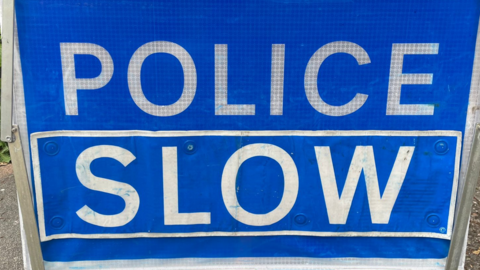 Police slow sign