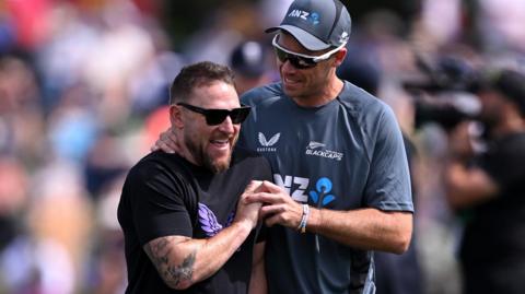 Tim Southee and Brendon McCullum share a joke