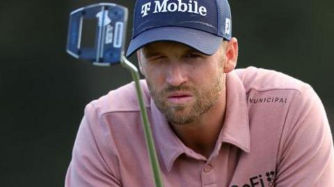 Wyndham Clark lining up a putt during the 2024 Masters