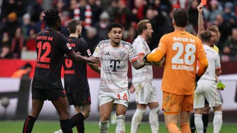 Luis Diaz, in predominantly white Bayern Munich away shirt, pleads his innocence after being sent off