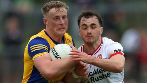 Tyrone's Darragh Canavan tackles Roscommon's Eoin McCormack