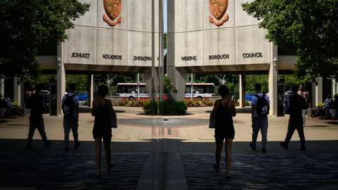 People outside Woking Borough Council offices 