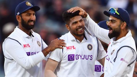 Virat Kohli, Umesh Yadav and Cheteshwar Pujara celebrate