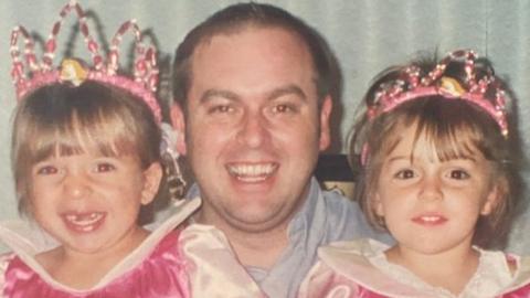 Mark Lang with his daughters Elena and Cara when they were children