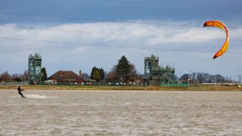 Kite surfer on a flooded field