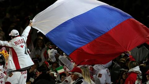 Russian athlete with the Russian flag
