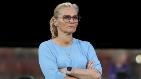 Sarina Wiegman on the touchline, wearing a light blue top, during England's 4-0 defeat by Spain