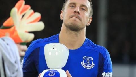 Phil Jagielka and the robot mascot