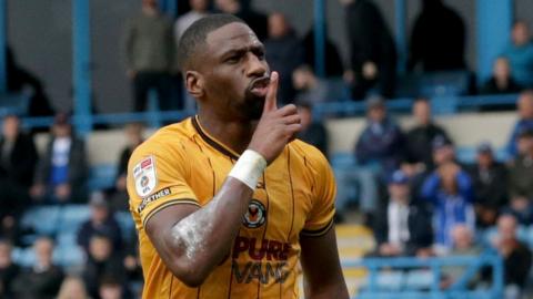Newport striker Omar Bogle shushes the Gillingham crowd after scoring two goals to secure victory for Newport County in League Two