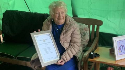 Jo with her certificate and medal