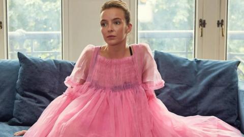 Jodie Comer as Villanelle in pink dress