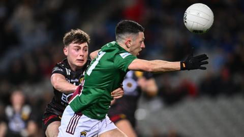 Ronan O'Toole of Westmeath in action against Ceilum Doherty of Down