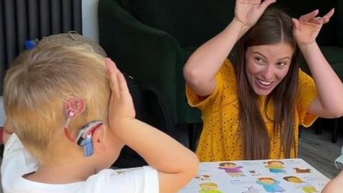 two children and a mum playing