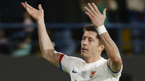 Robert Lewandowski celebrates scoring a goal for Barcelona