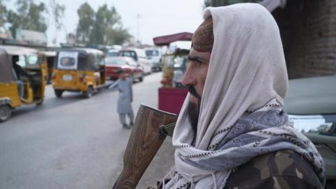 Man with gun in Jalalabad, Afghanistan