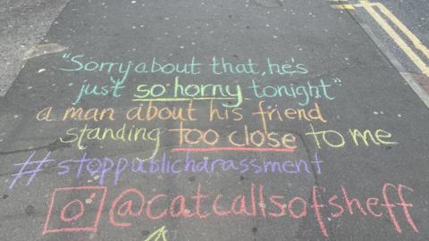 An account of someone's sexual harassment experience seen chalked on a pavement