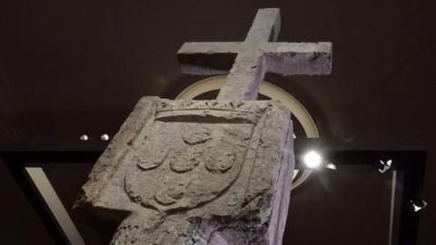 The Stone Cross on display in a Berlin museum
