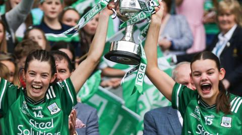 Eimear and Bronagh Smith lift the trophy after Fermanagh's victory over Louth