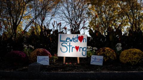A sign memorializing the deaths in the Lewiston, Maine shooting
