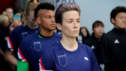 US Women's striker Megan Rapinoe prepares to lead the team out at the SheBelieves cup with her jersey turned inside out to hide the badge