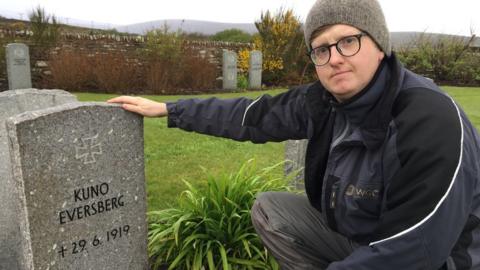 Robert Ross with headstone