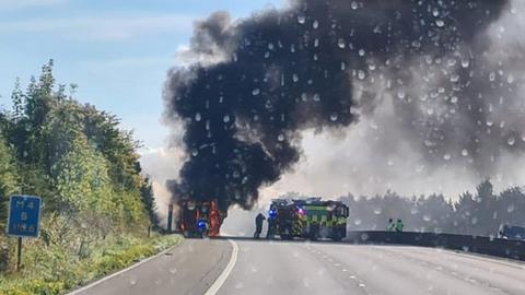 Smoke rising from a lorry on fire on the M4
