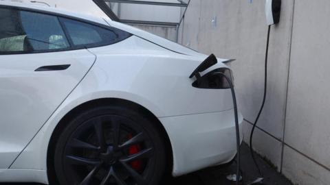 An electric vehicle plugged in