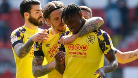 Huddersfield celebrate Aaron Rowe's opener