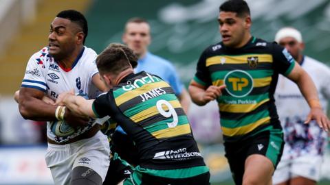 Siva Naulago of Bristol Bears is tackled by Tom James of Northampton Saints