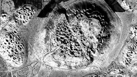 Satellite image showing pits in Afghan archaeological site, which researchers say have been dug by looters