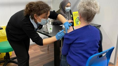 Patient receives coronavirus vaccine at Asda in Watford