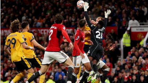 Man Utd goalkeeper Andre Onana appears to foul two Wolves players