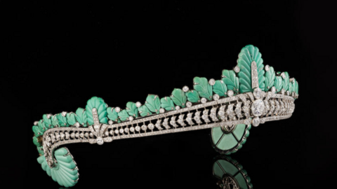 The tiara from the side showing the turquoise plumage and large diamond at the centre.

