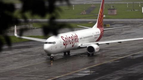 An aircraft from Indian carrier SpiceJet taxis towards takeoff at the domestic airport in Mumbai on 15 July 2008